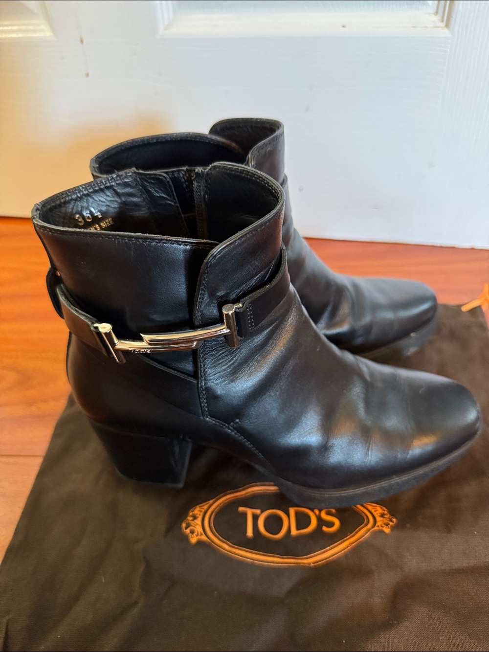 Tod's Black Leather Ankle Booties with Gold-Tone Buckle